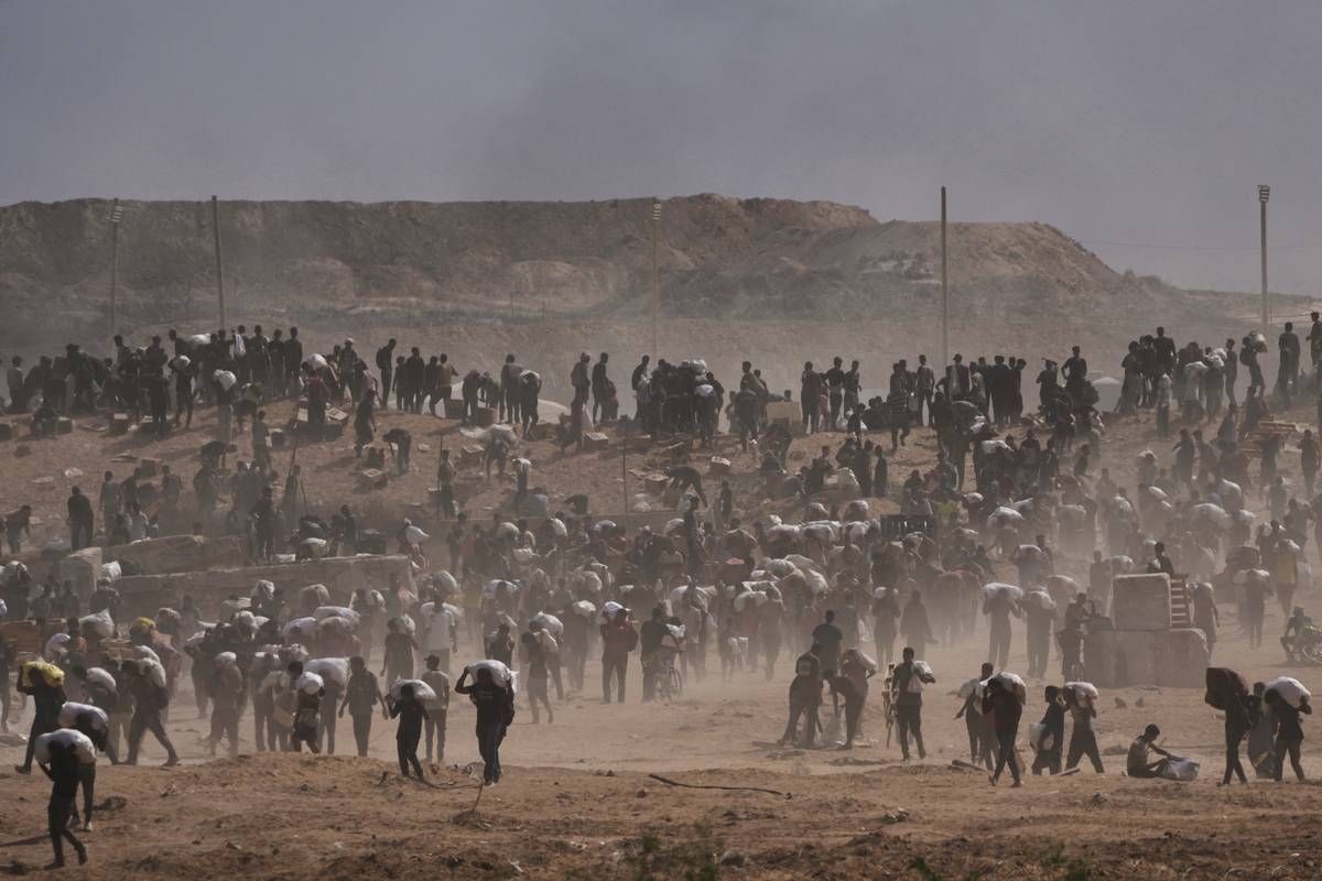 Dozens Killed as Palestinians in Gaza Scramble for Aid from Air and Land