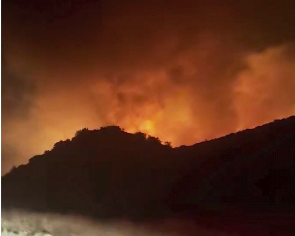 Firefighters Make Progress against Fast-Moving Blaze Along Highway North of Los Angeles