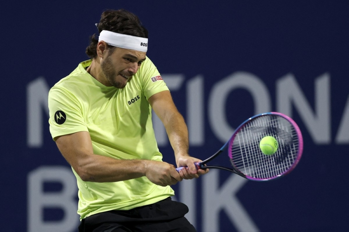 Fritz beats rain, Carballes Baena to advance in Toronto