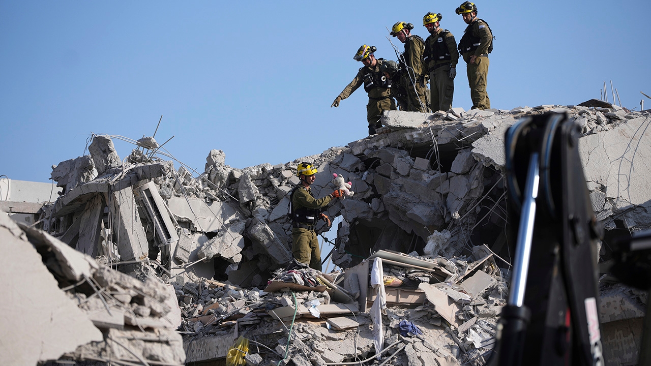 Iranian missile strikes in Israel kill at least 2 as defense minister warns 'Tehran will burn'