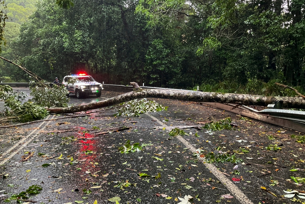 Flash floods cut off inland Australian towns, residents flee to rooftops