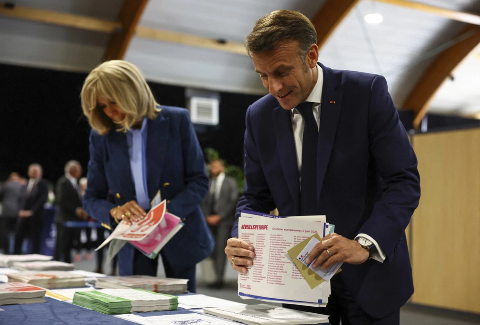 Elysee plays down apparent shove on Macron from wife during SEA tour