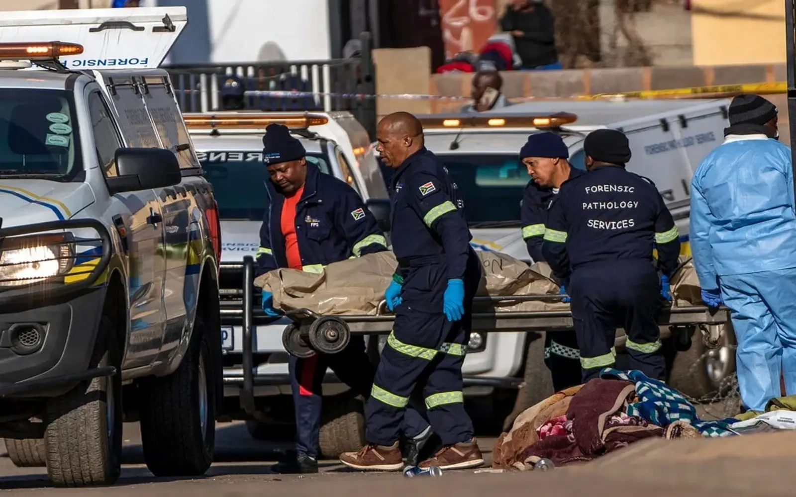 Police hunt gunmen after 8 killed in South African bar