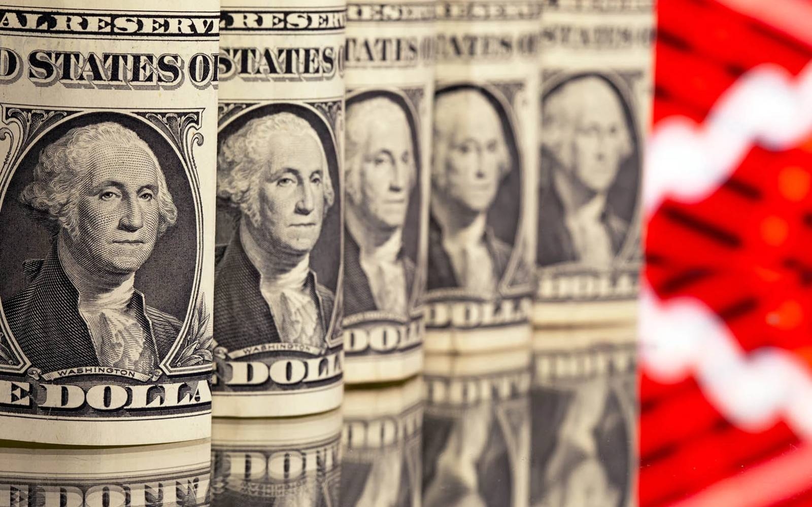 Dollar slides on Fed expectations, murky trade picture