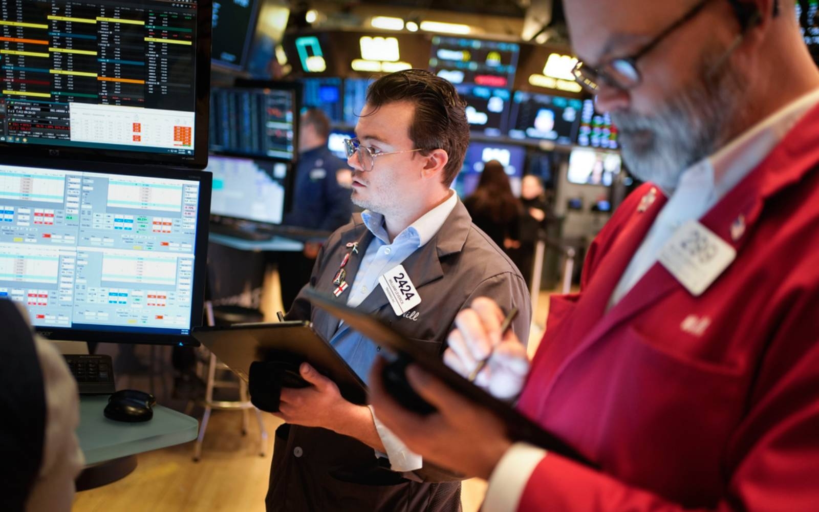 Stocks tick up, dollar hits 2025 low amid mixed macro signals