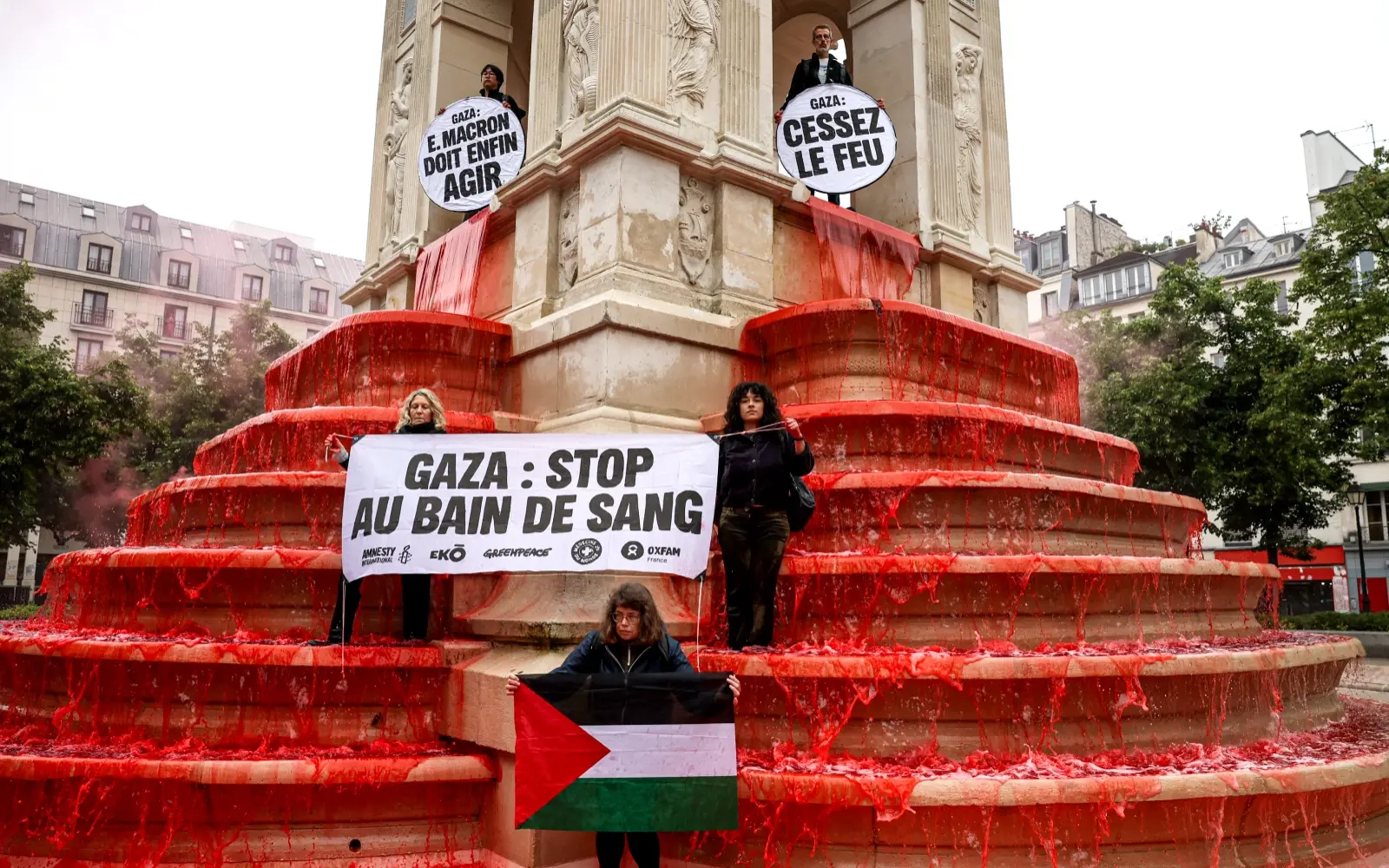 Activists turn Paris fountain red to denounce Gaza ‘bloodbath'