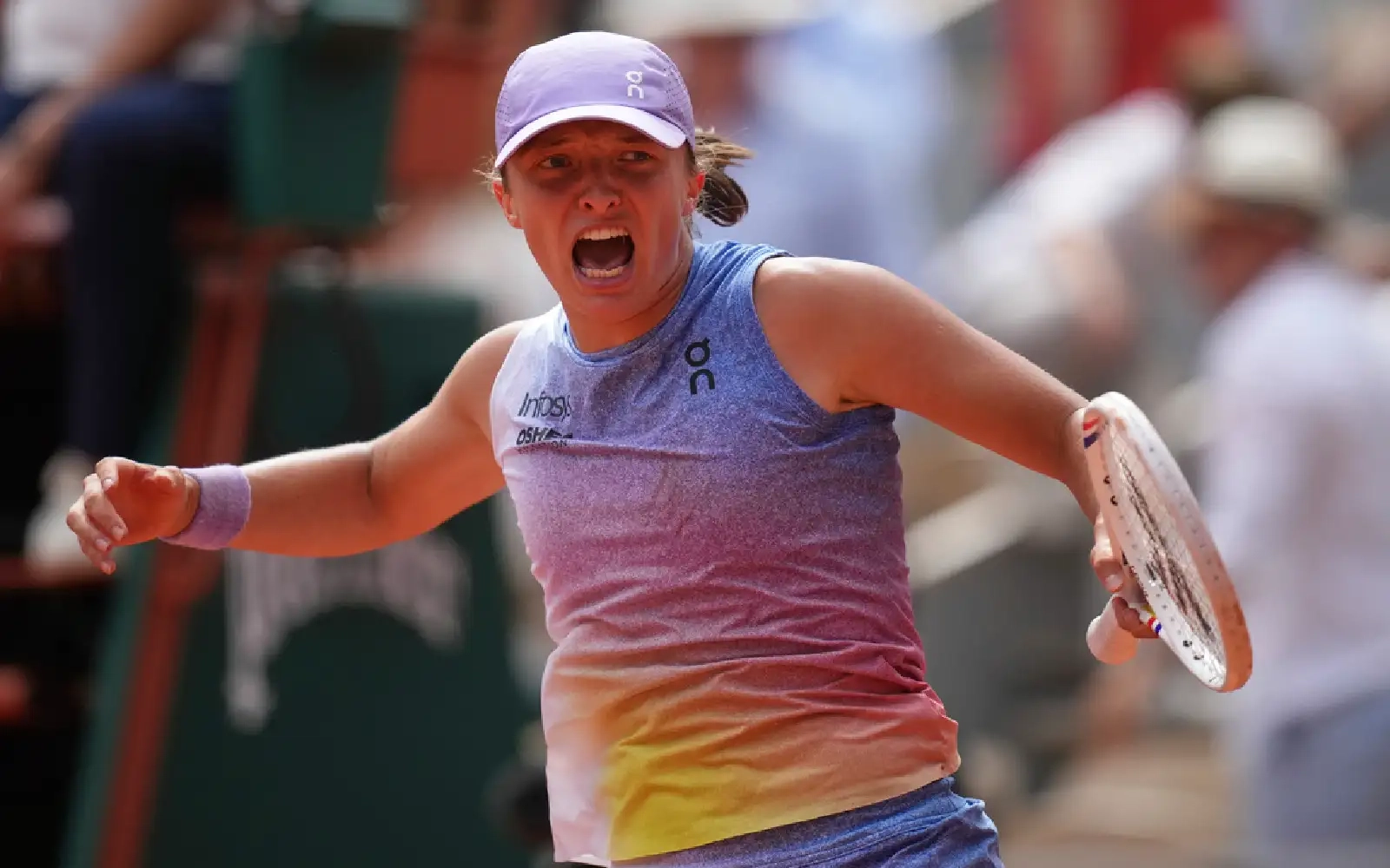 Swiatek claws back from the brink to reach French Open last 8