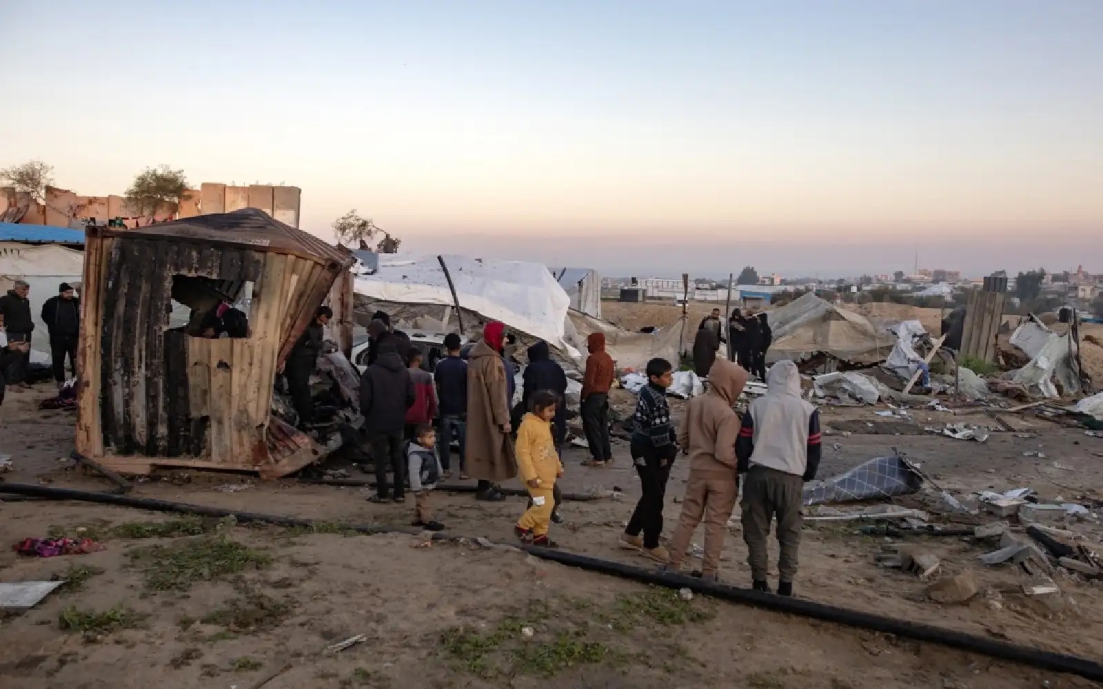 Israeli forces kill 25 in Gaza, including 12 in shelter for displaced