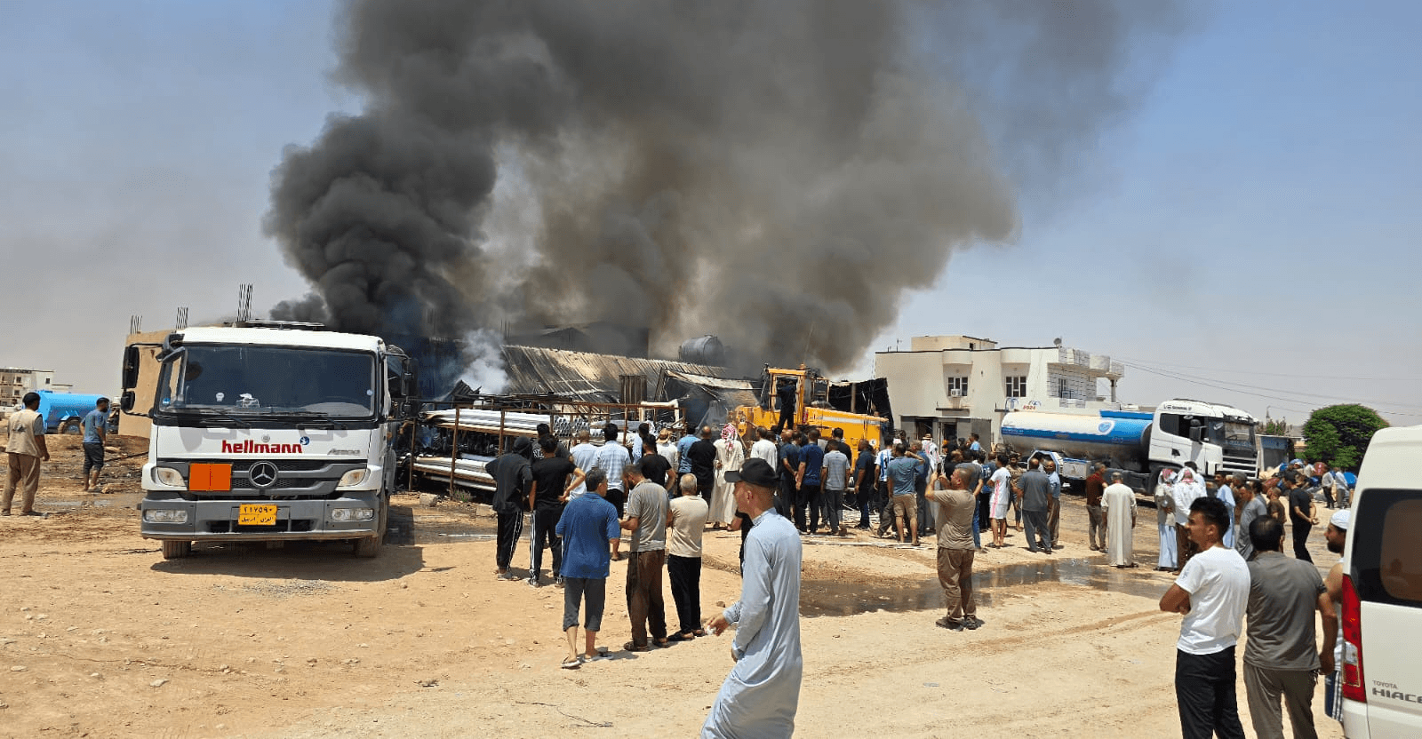 Fires erupt across Iraq, hitting a company and school