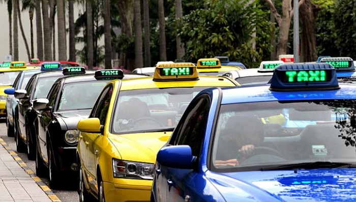 Grab ride sign states that passengers will be charged a premium if the aircon and seats are adjusted without the driver's permission