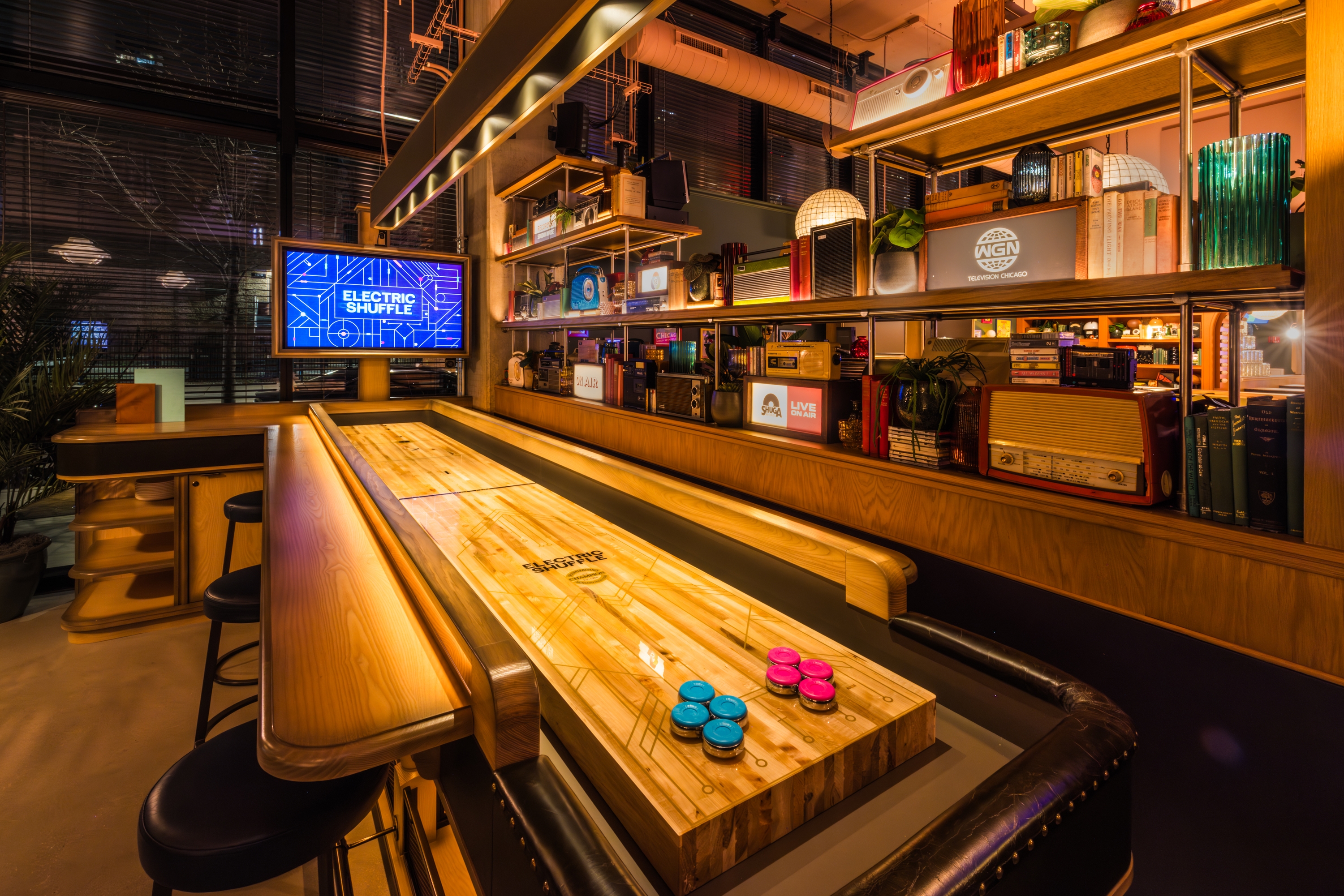 This neon-lit shuffleboard bar from London is officially open in Chicago