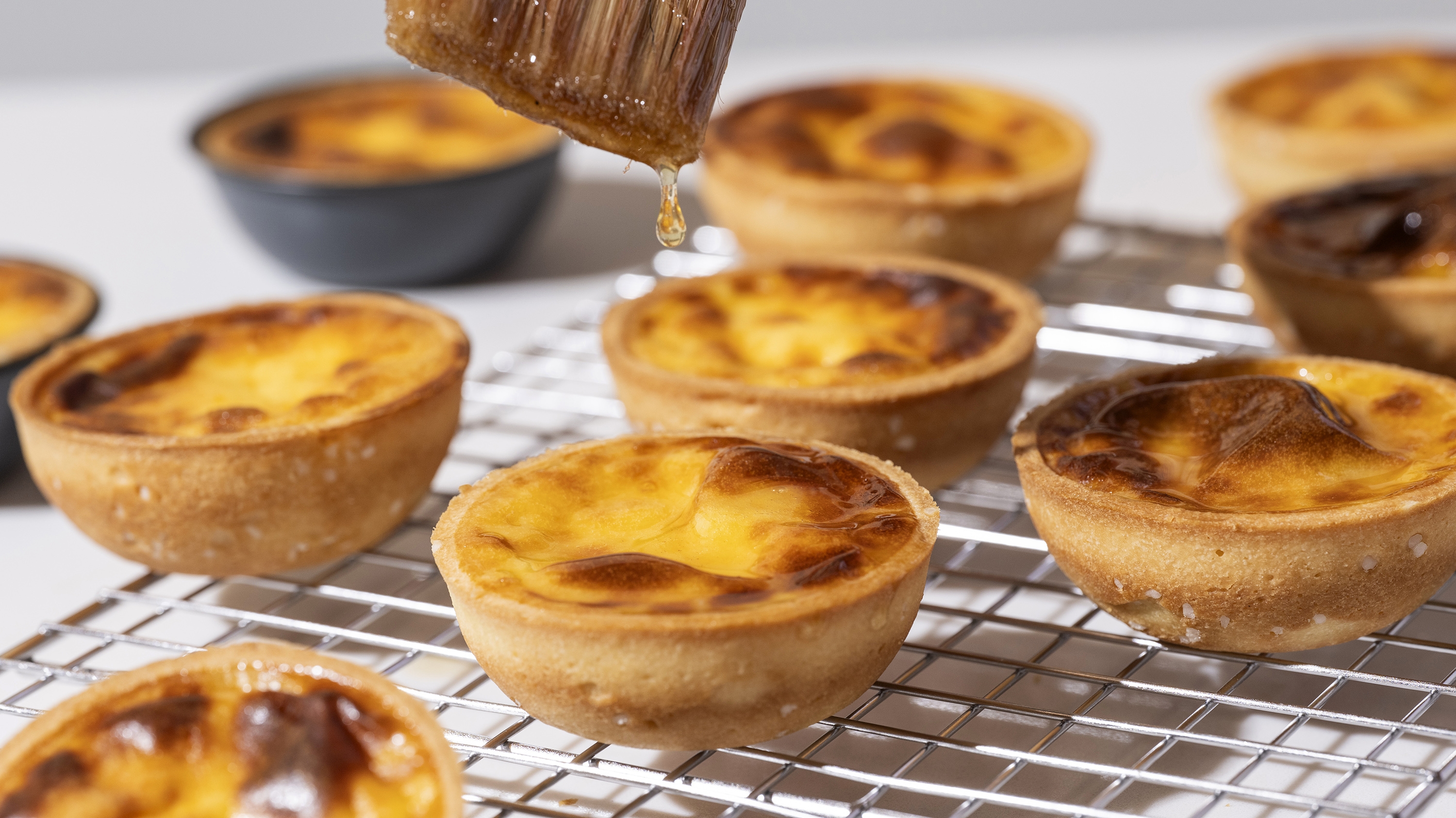 Dominique Ansel is serving hot dog Danishes and pretzel egg tarts at his new bakery