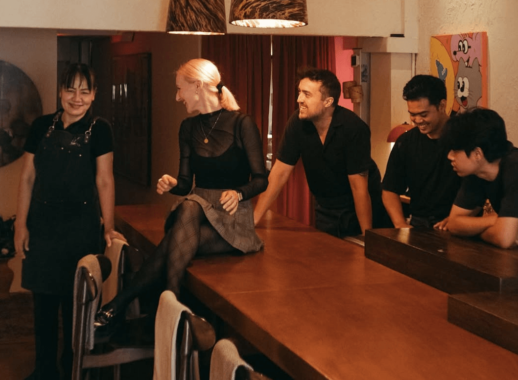 The ten-seat table where dinner has a score