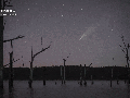 Comet blazes past aurora in Australia's night sky