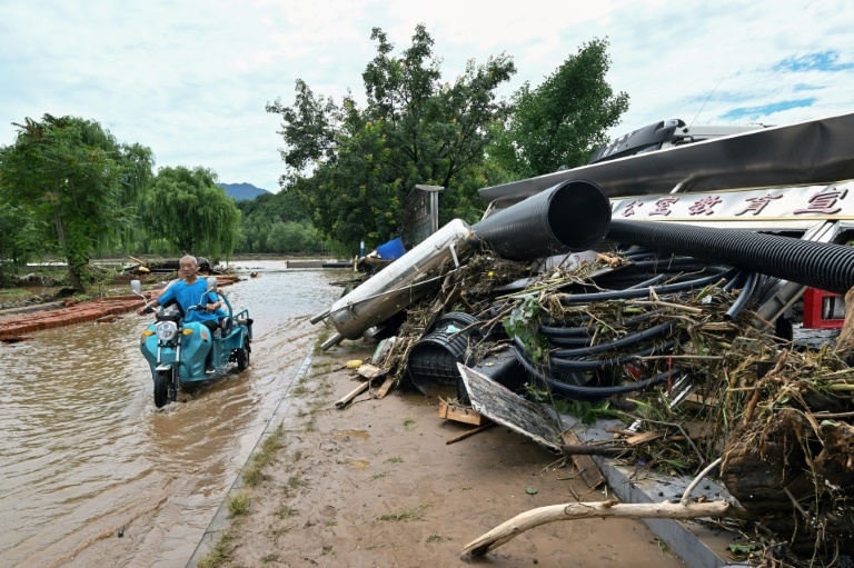 Beijing officials admit 'gaps' in readiness after rain kill dozens