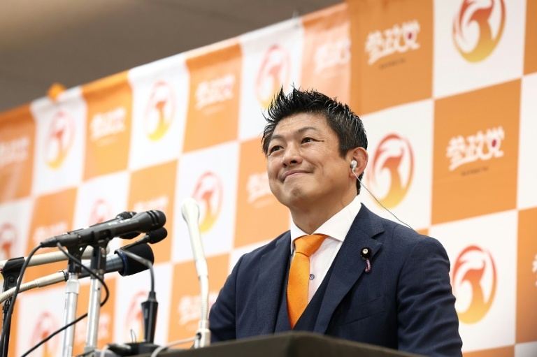 Japan PM hangs on after 'extremely regrettable' election