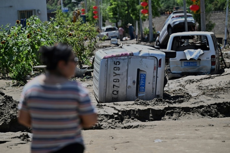 Beijing issues new storm warning after deadly floods