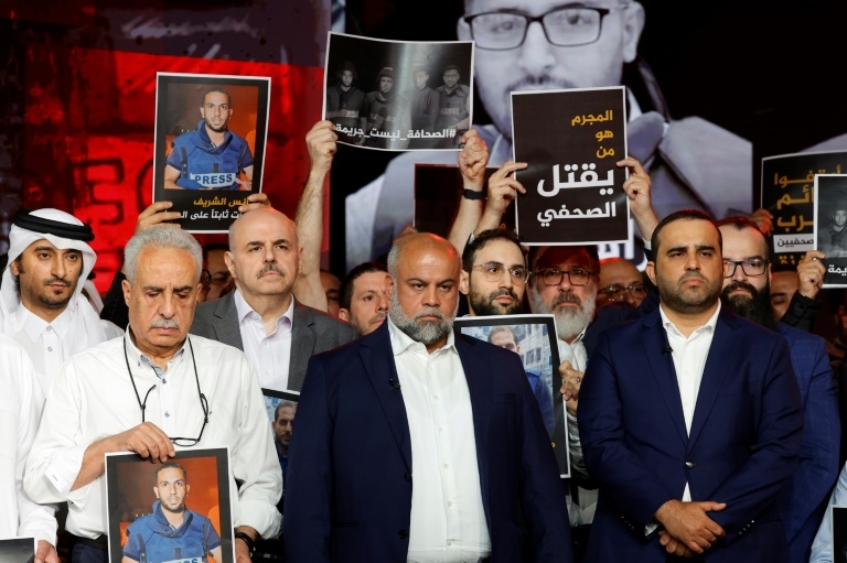 Al Jazeera journalists hold vigil for staff slain in Gaza