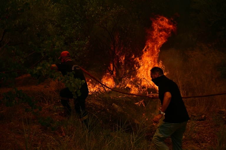 Thousands battle Greece fires as heatwave bakes Europe