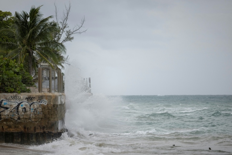 Hurricane Erin intensifies offshore, lashes Caribbean with rain