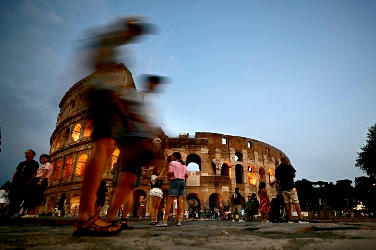 Fleeing the heat, tourists explore Rome at night, underground