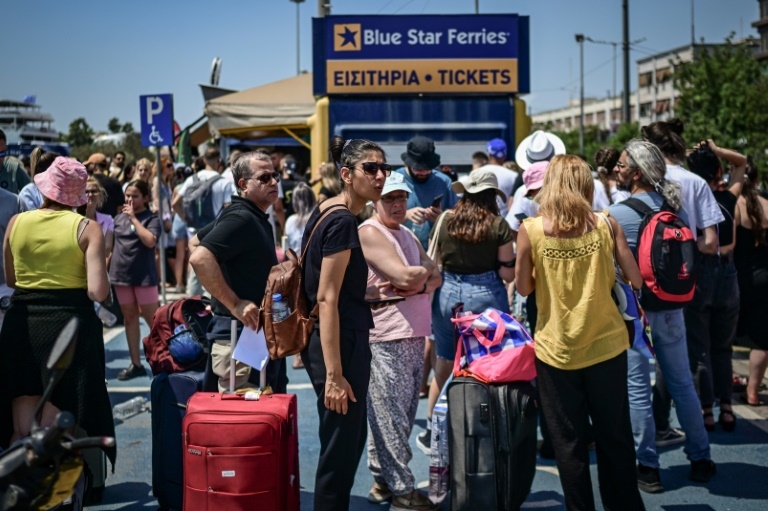 Two tourists die, fires erupt in Greece amid gale-force winds