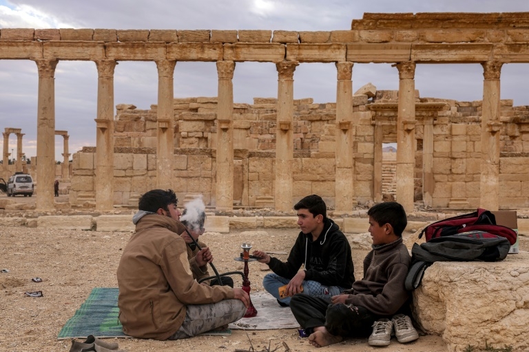Syrians back to famed Palmyra ruins scarred by IS