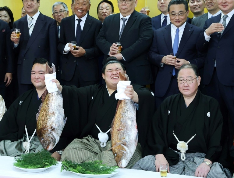 Onosato, 24, promoted to sumo grand champion in record time