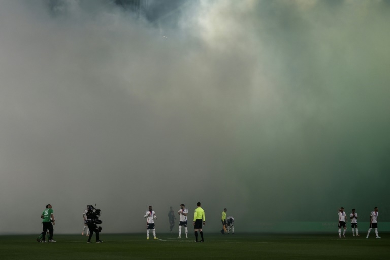 Ligue 1 derby halted after assistant referee hit by projectile