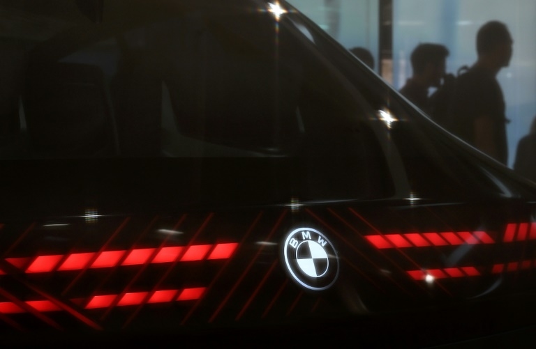 BMW says can weather tariff storm despite profit plunge