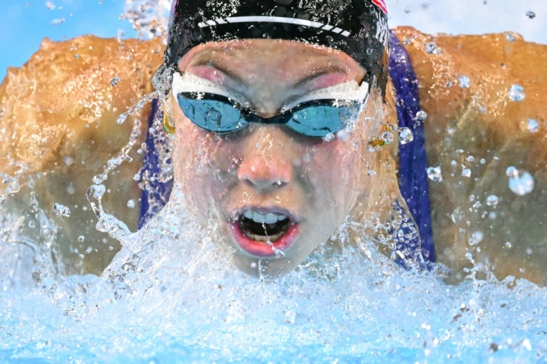 Walsh defies illness in US camp to win butterfly world gold