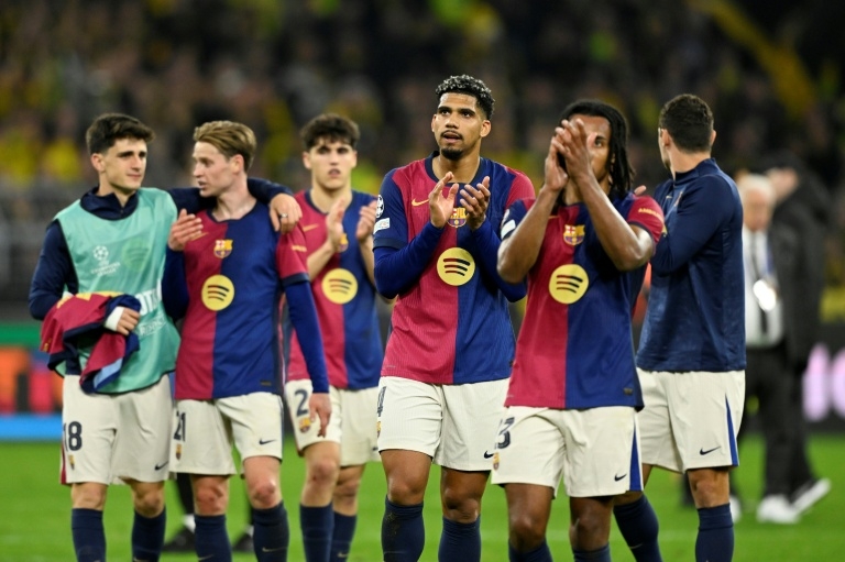 Barca suffer morale blow in Dortmund amid quadruple hunt