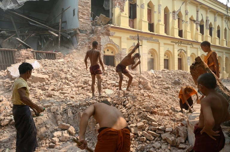 Like 'living in hell': Quake-hit Mandalay monastery clears away rubble