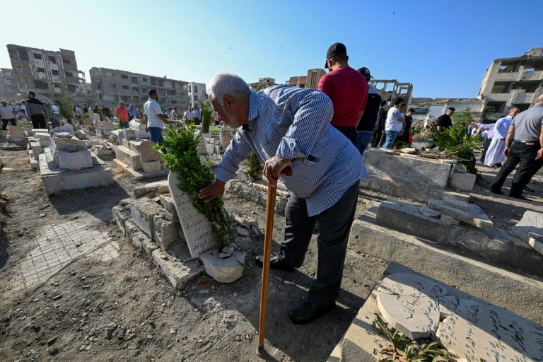In Syria's devastated Jobar, cemetery comes alive for Eid