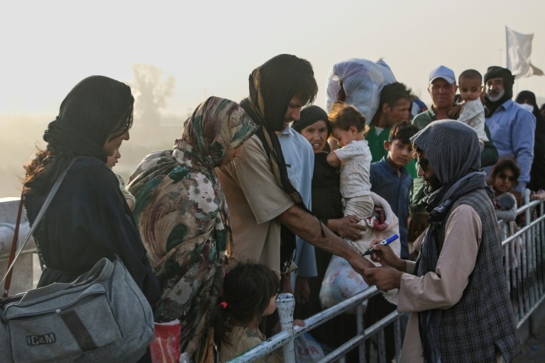 Afghans show solidarity as migrant returns from Iran surge