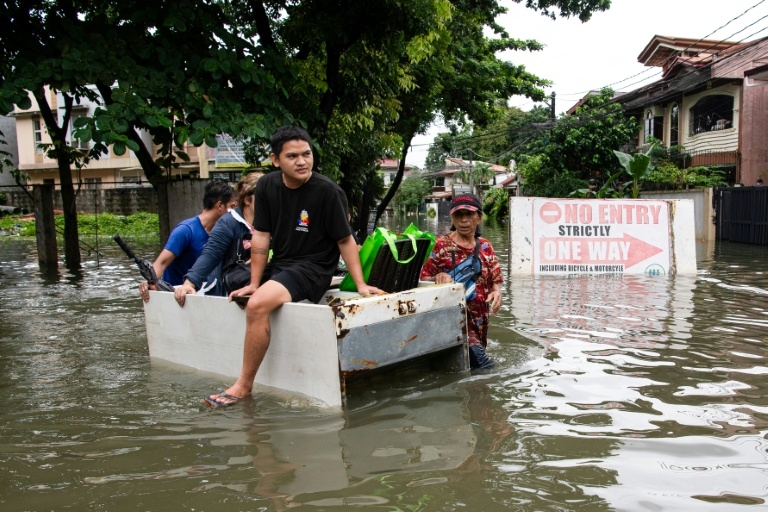 Philippines flooding displaces thousands as new storm threatens