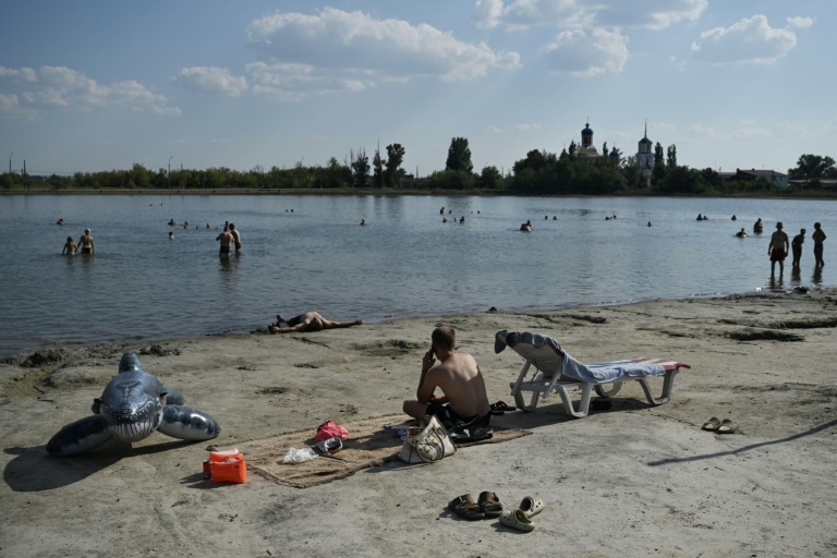War-weary Ukrainians find solace by frontline lake