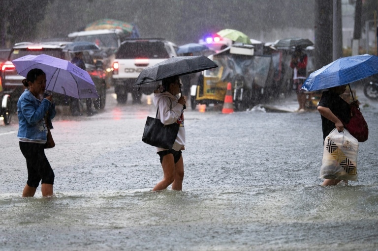 Philippines flooding displaces thousands, two missing