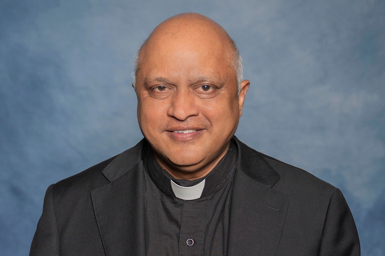 A man is in custody after the fatal shooting of a beloved Kansas priest
