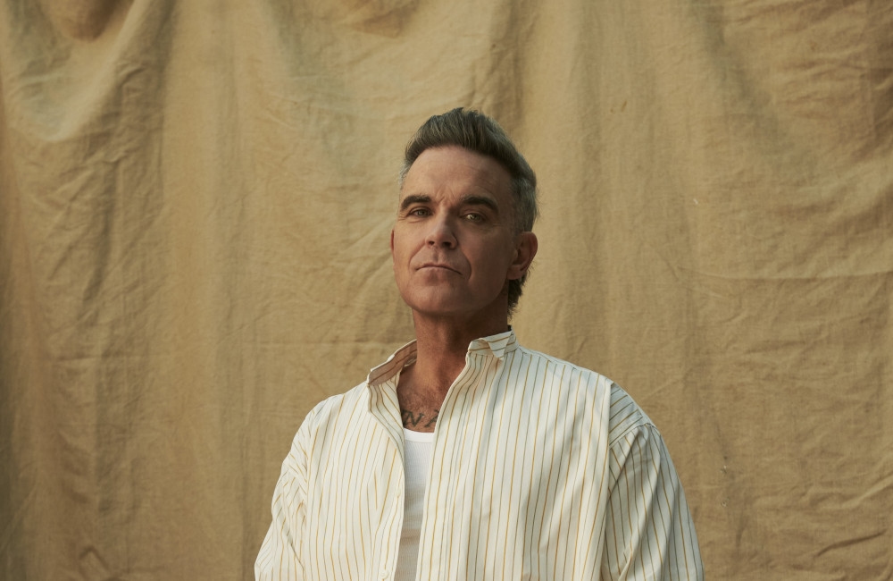 Robbie Williams drops guitar anthem Spies