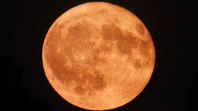 Rare Strawberry Moon captured over region