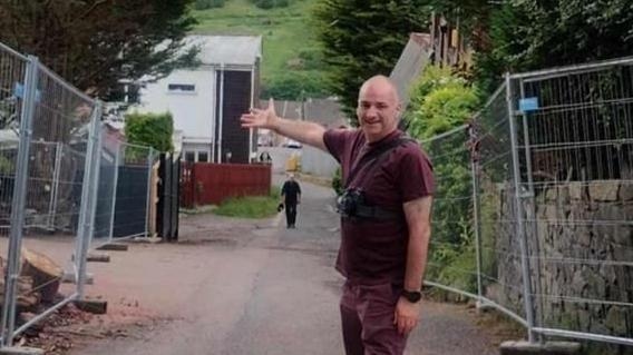 Residents celebrate as neighbour's gate is removed