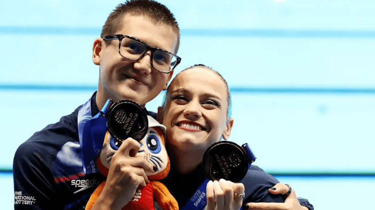Swimmer misses graduation to win bronze medal