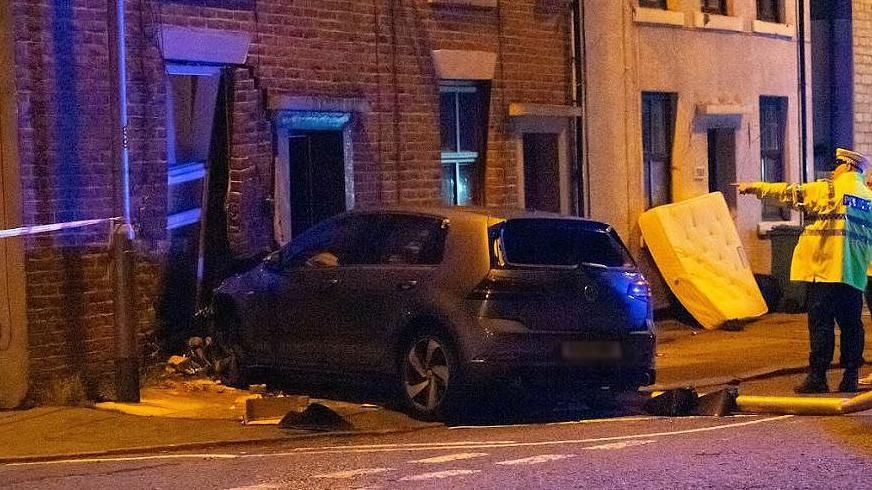 Car smashes into front of house in early hours