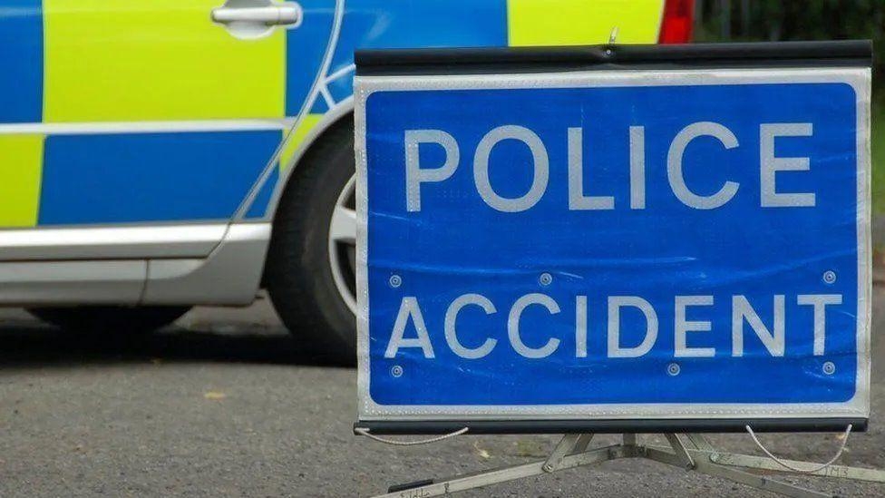 Van driver arrested after biker dies in collision