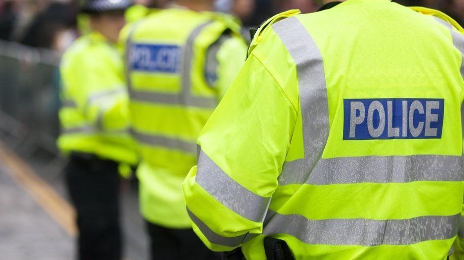 Car passenger shoots at pedestrian in town centre