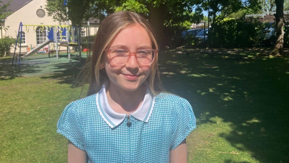 Pupils cross the divide by walking Derry's Walls