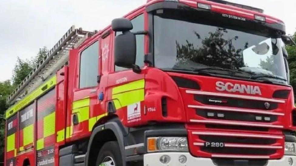 Firefighters battle to put out wildfire