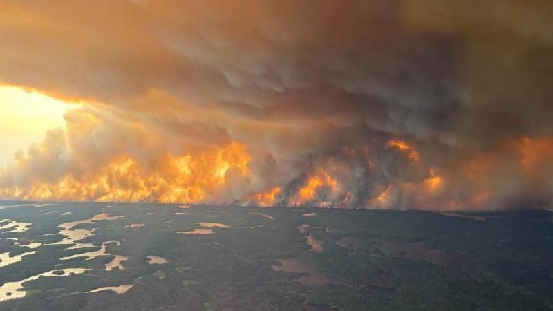 Thousands flee wildfire in Manitoba as 'out of control' blazes burn across Canada