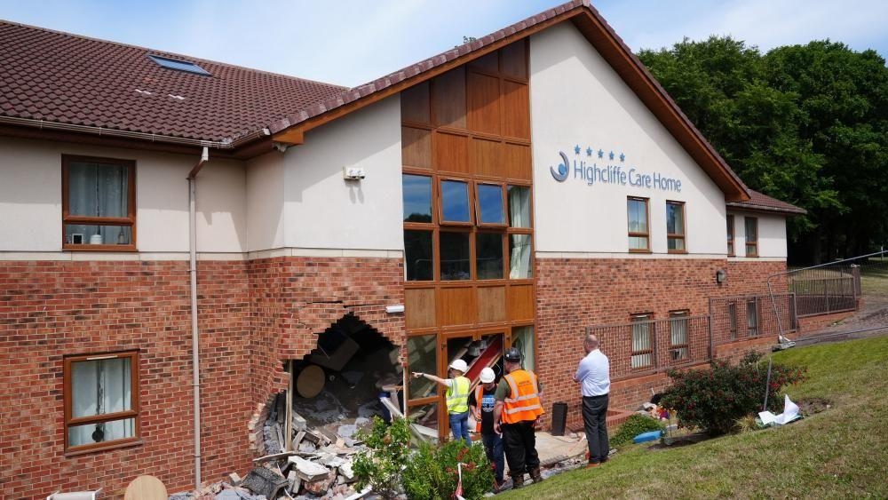 Men charged after women die following care home crash
